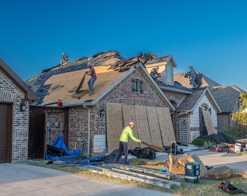 people installing a roof